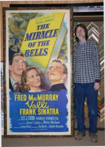 Mark with a large Miracle of the Bells movie poster